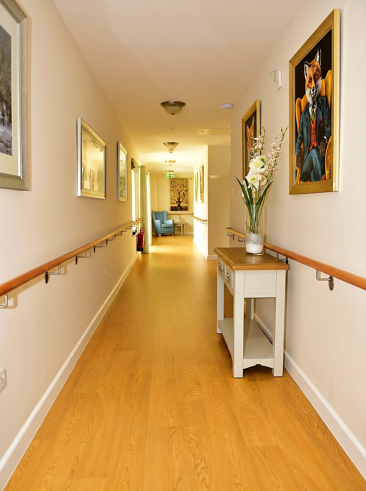 A bright corridor with artwork at Castle House