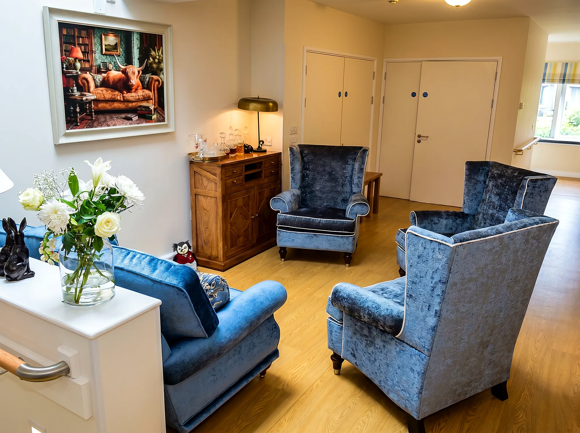 A cosy sitting area with velvet armchairs at Castle House